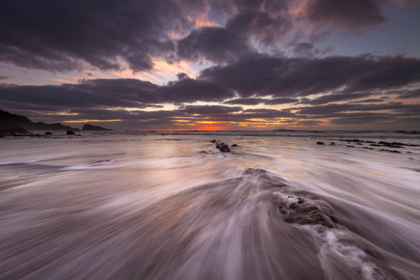 istock Waves crash over the sand at Welcombe Mouth beach in  Devon 1165765014