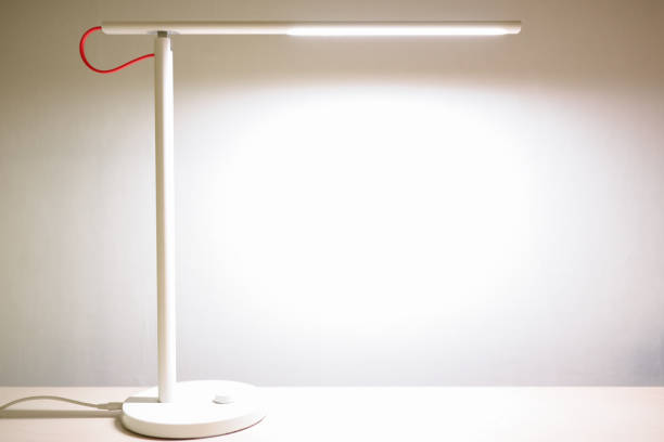 LED lamp shines brightly on the desktop.