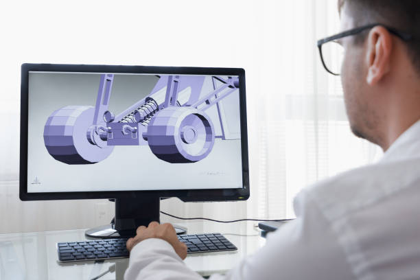 istock LOS ANGELES, CALIFORNIA - JUNE 3, 2019: Engineer, Constructor, Designer, Architect in Glasses Working on a Personal Computer. He Creating New Component of BAGGI in CAD Program. Freelance Work. An illustrative editorial image 1165770275