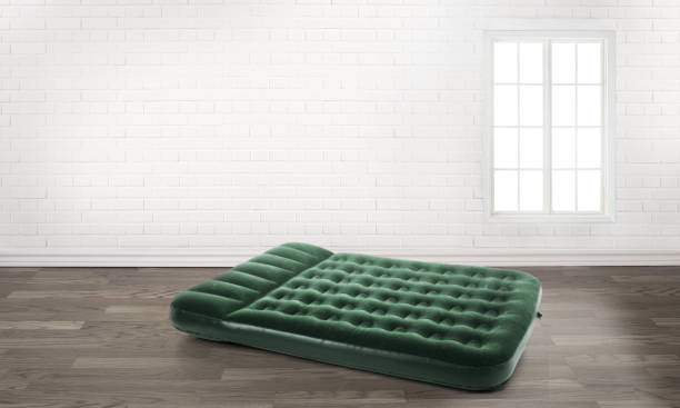 inflatable mattress in an empty room inflatable mattress in an empty room pool raft stock pictures, royalty-free photos & images