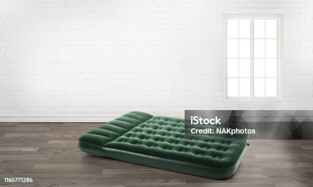 Inflatable Mattress In An Empty Room Stock Photo - Download Image Now - Pool Raft, Inflatable, Mattress