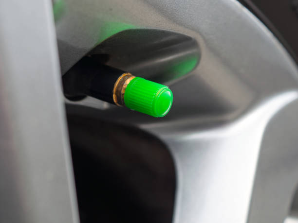 istock a green tire valve caps 1165771432