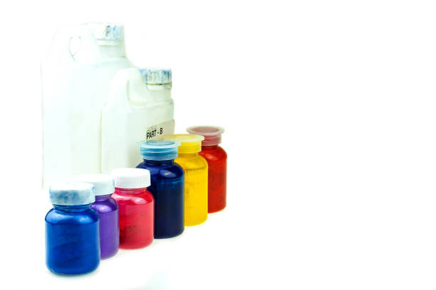 istock Mixing color epoxy resin in plastic cup for casting Stabilizing wood and pine cone hybrid 1165772790