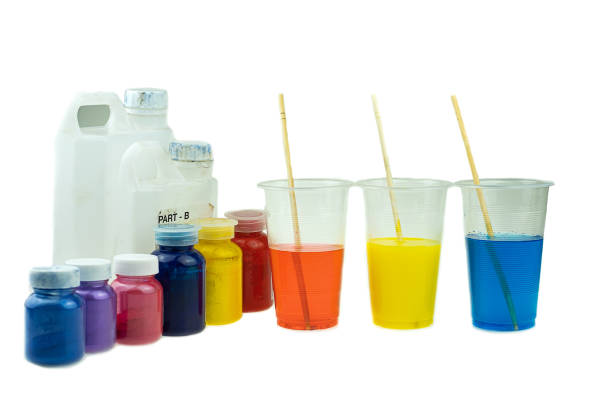 istock Mixing color epoxy resin in plastic cup for casting Stabilizing wood and pine cone hybrid 1165772829