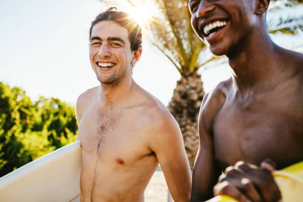 istock Friends going surfing on their holiday 1165772940