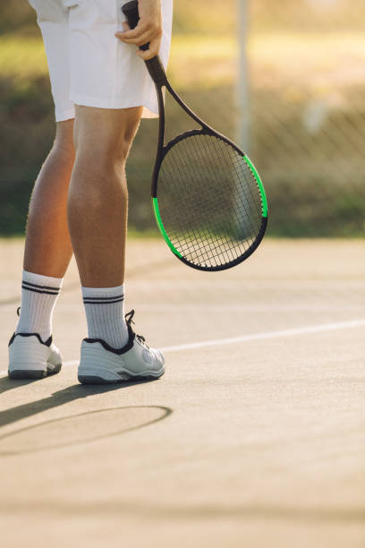 istock Tennis player a on hard court 1165773850