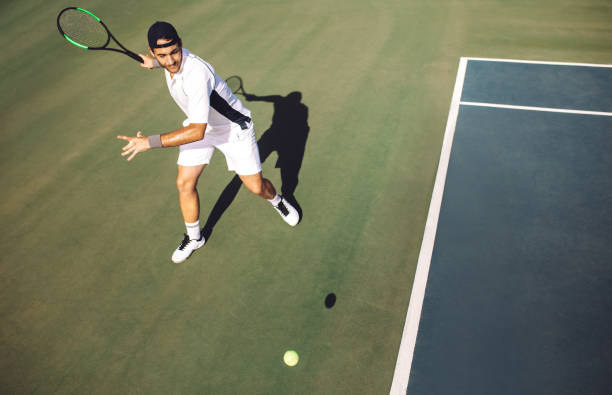 istock Tennis player hitting a forehand from baseline. 1165773860