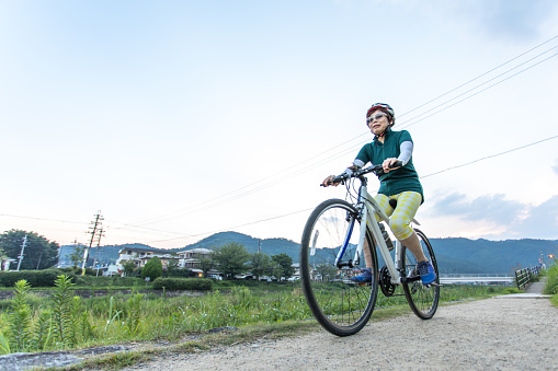Senior woman enjoying cycling
