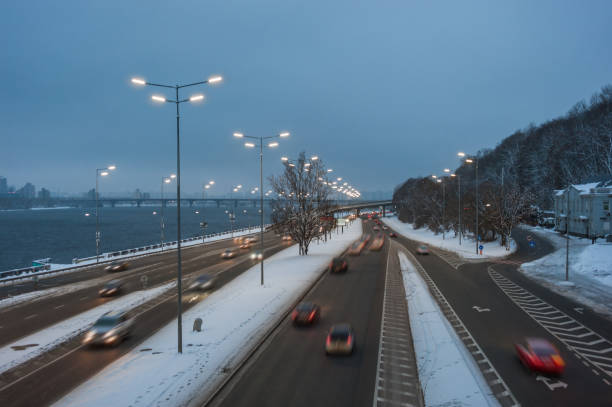 istock Evening cityscape with auto on highway 1165776648