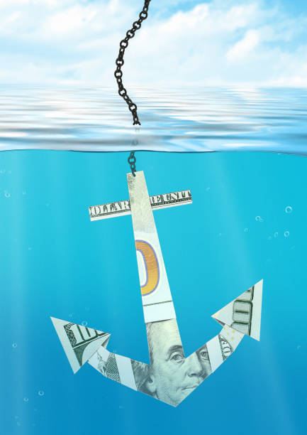 istock financial problems concept, anchor made of money 1165778743