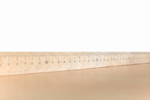 istock Wooden ruler on the table and white background, copyspace 1165779067