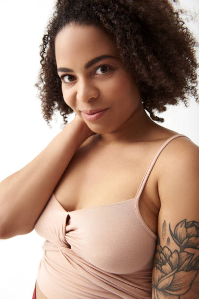 istock Smiling Afro American female with tattoo on arm 1165783792