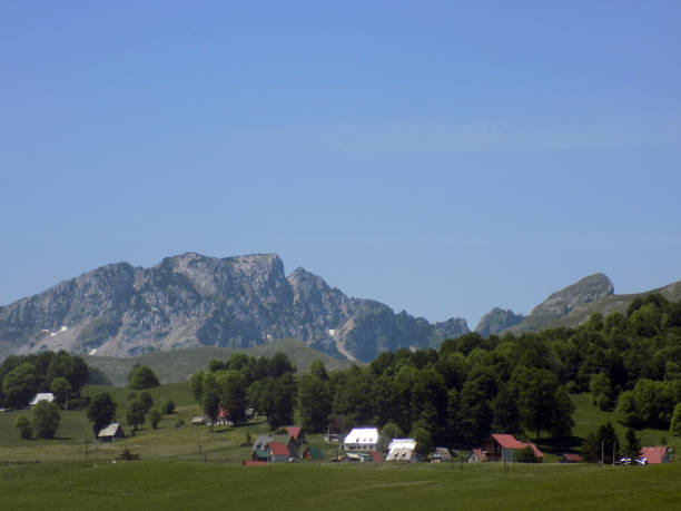 istock Small village with a large mountain in the background 1165787967