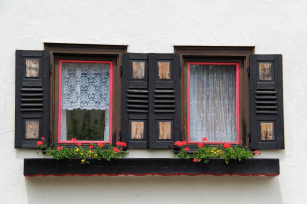 istock Shuttered windows - Old houses with shuttered windows 1165788681