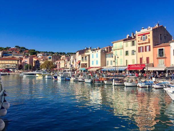 Cassis, France - February 21, 2016: harbor of french town Cassis situated on the Mediterranean coast in sunset light.