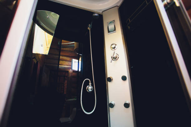 istock Modern and big shower cabin in bathroom corner. 1165788764