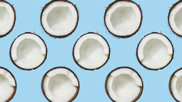 Coconuts rotating on blue background