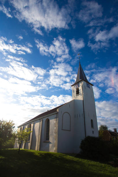 istock Feerwerd, Groningen, Netherlands: White Church (Jacobus Church) Dramatic Sky 1165791095
