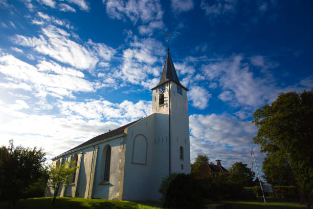 istock Feerwerd, Groningen, Netherlands: White Church (Jacobus Church) Dramatic Sky 1165791100