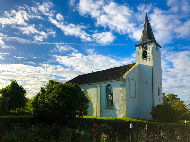 istock Feerwerd, Groningen, Netherlands: White Church (Jacobus Church) Dramatic Sky 1165791620
