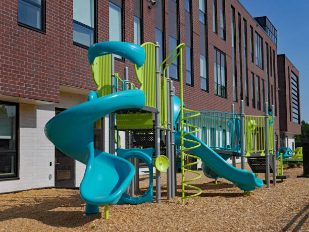 istock large brick school building with playground equipment 1165795917