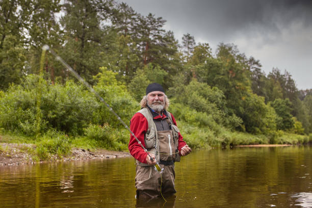 istock Mature man during fly fishing in river. 1165797992