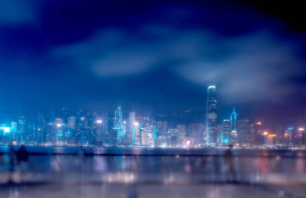 istock Abstract bokeh light with Hong Kong City night view background; Double Exposure 1165800460