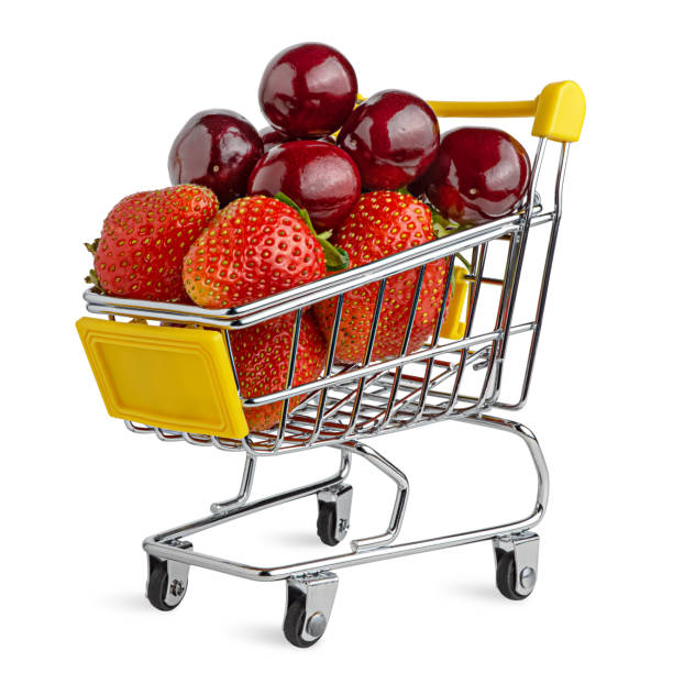 Fresh tasty cherry and strawberry mix in the shopping cart. stock photo