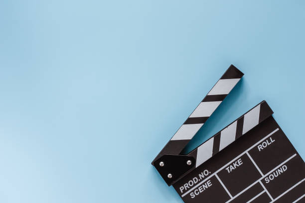 Movie clapper board on blue background for filming equipment Movie clapper board on blue background for filming equipment director photos stock pictures, royalty-free photos & images