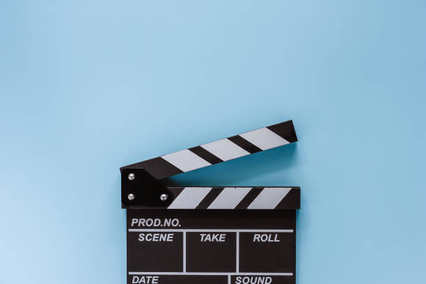 istock Movie clapper board on blue background for filming equipment 1165819325