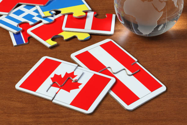 istock Canada and Austria Flags in puzzle 1165822644