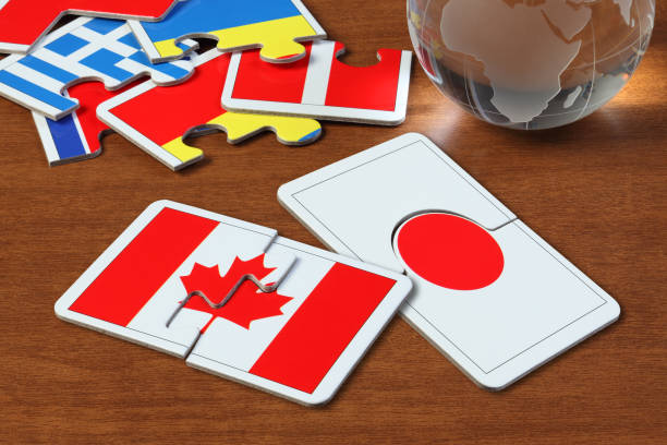 istock Canada and Japan Flags in puzzle 1165823154
