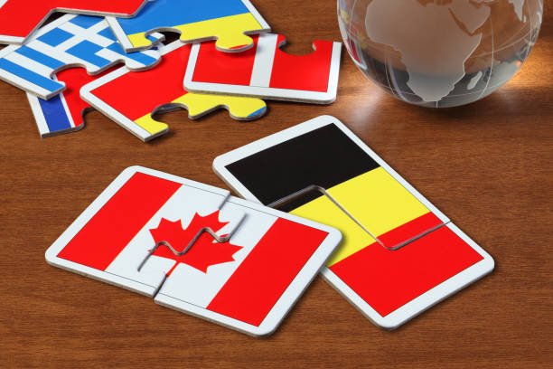 istock Canada and Belgium Flags in puzzle 1165823159