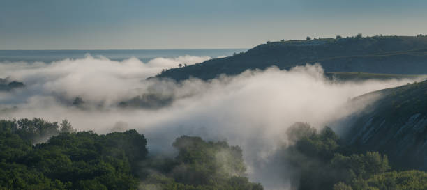 istock Panorama with fog over hills 1165836926