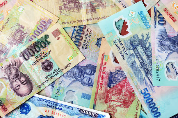 istock Various Vietnamese dong banknotes close-up. Money background 1165843686
