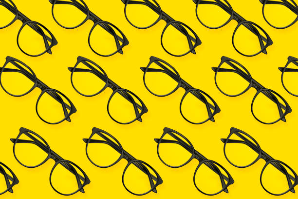 istock Flat lay sunglasses pattern on pastel yellow background. Minimal summer concept 1165846610