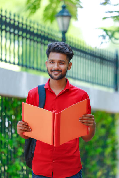 istock College Boy holding with file in hand 1165850442