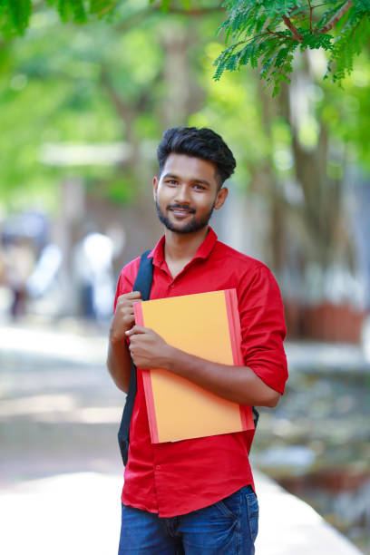 istock College Boy holding with file in hand 1165850448