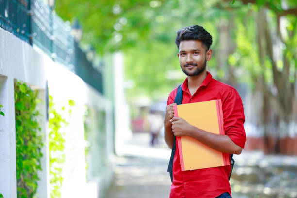 istock College Boy holding with file in hand 1165850453