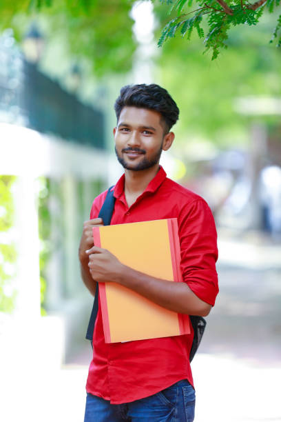 istock College Boy holding with file in hand 1165850472