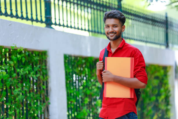 istock College Boy holding with file in hand 1165850486