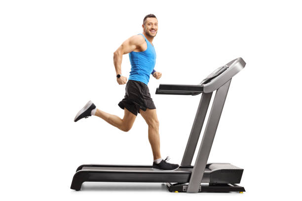 istock Male athlete running fast on a treadmill 1165851258