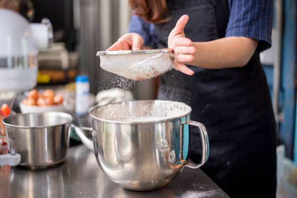 istock Beautiful woman is making bakery 1165851305