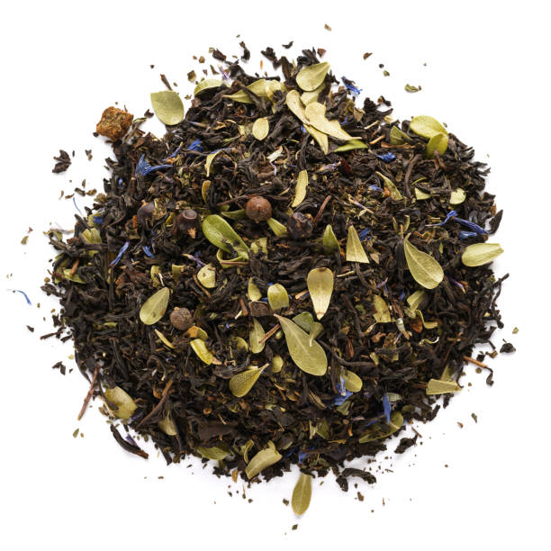 istock Dry black tea mixed with herbs, flower petals and berries. 1165851528