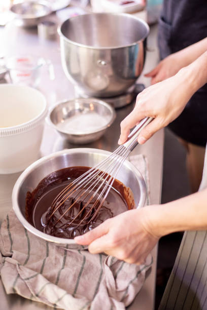 istock Beautiful woman is making bakery 1165851630