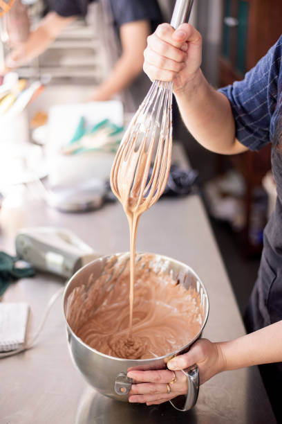 istock Beautiful woman is making bakery 1165855228
