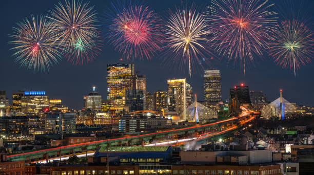 istock Multicolor Firework Celebration over Scene of Boston skyline which can see Zakim Bridge and Tobin Bridge with express way over the Boston Cityscape, 4th of July and Independence day concept 1165855782