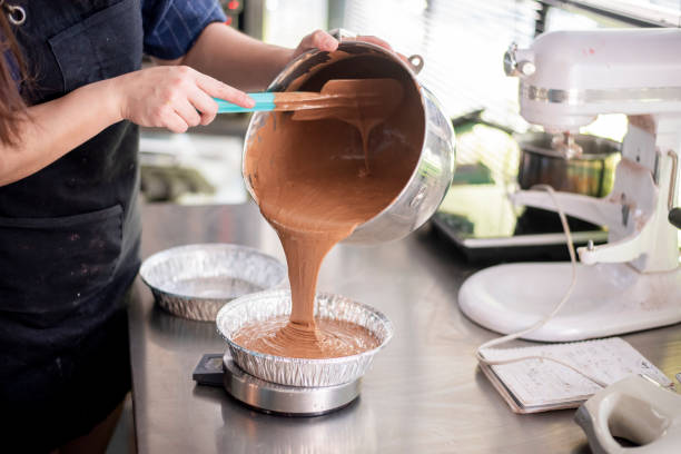 istock Beautiful woman is making bakery 1165855803