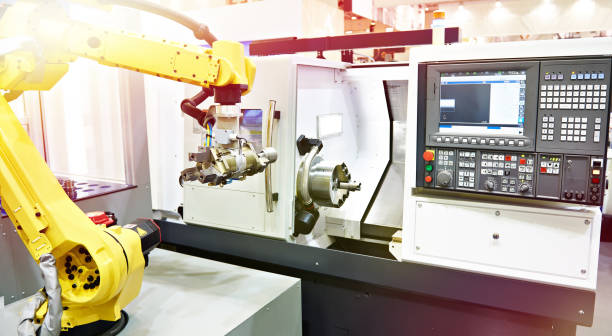 istock Robotic arm and cnc lathe 1165855804