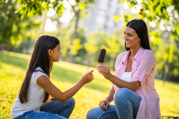 istock Happy family in park 1165856695